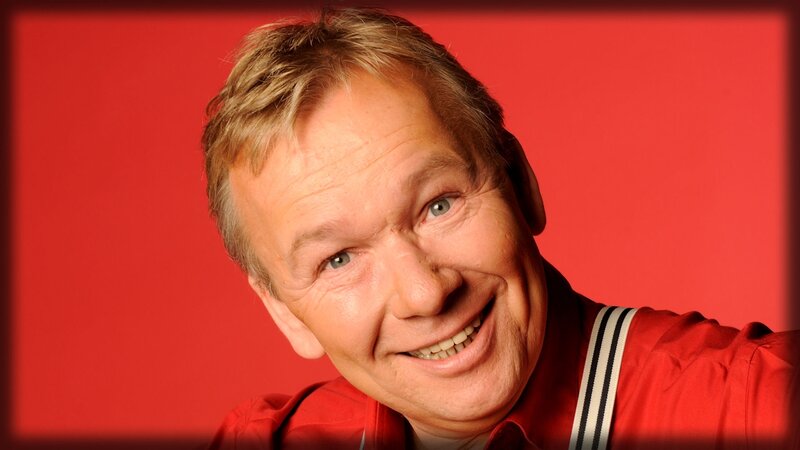 man in red shirt smiling