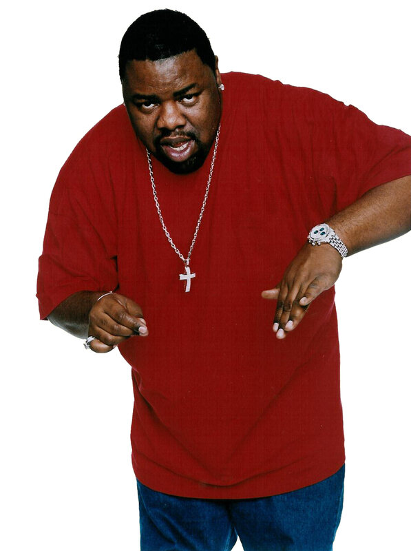 Man in red shirt with cross necklace