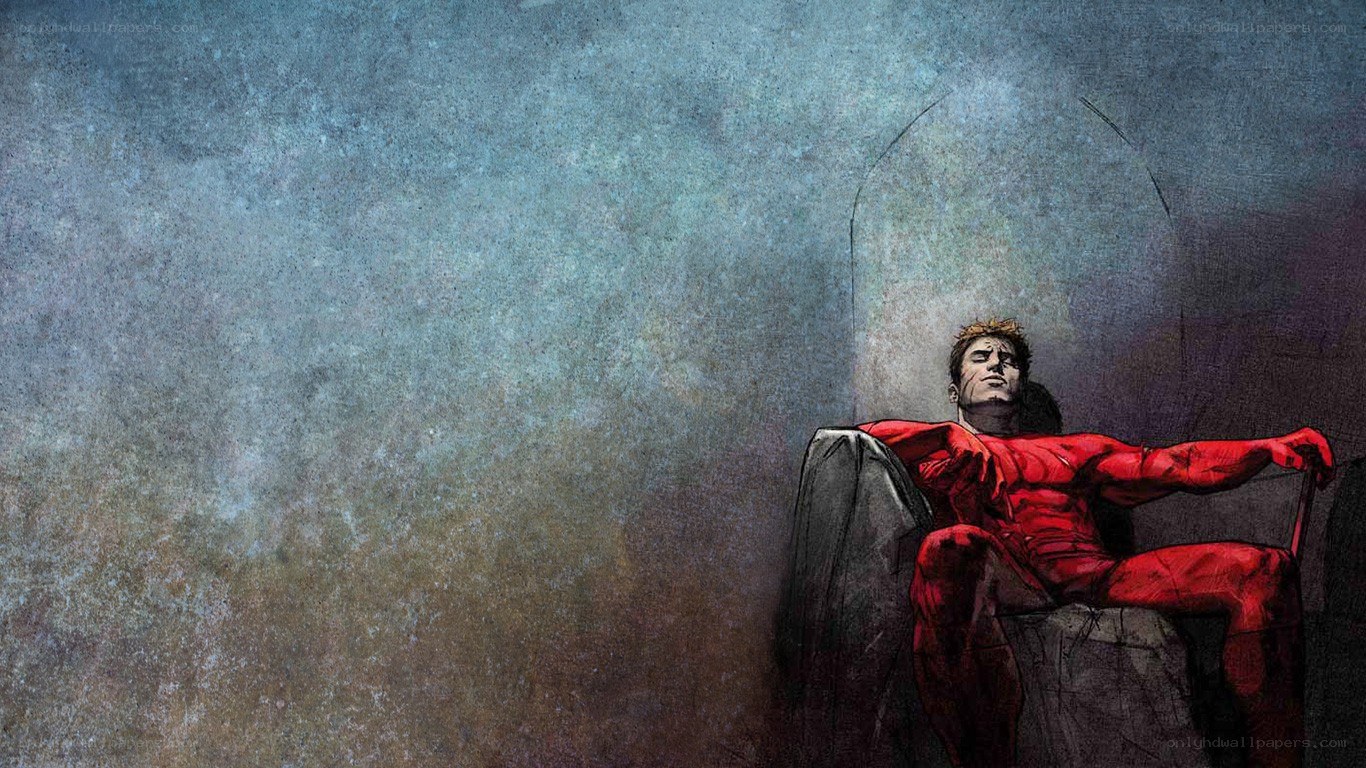Man in red suit sitting