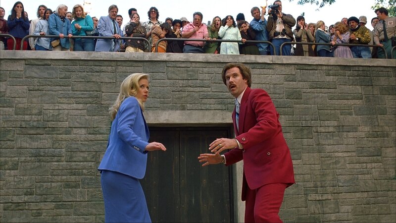 Man in red suit with woman