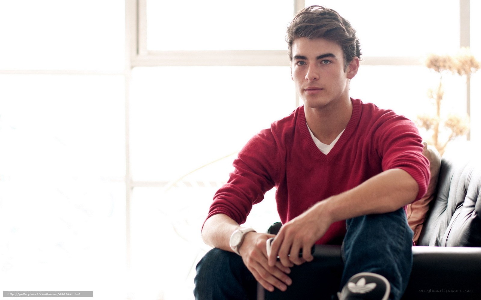 man in red sweater sitting