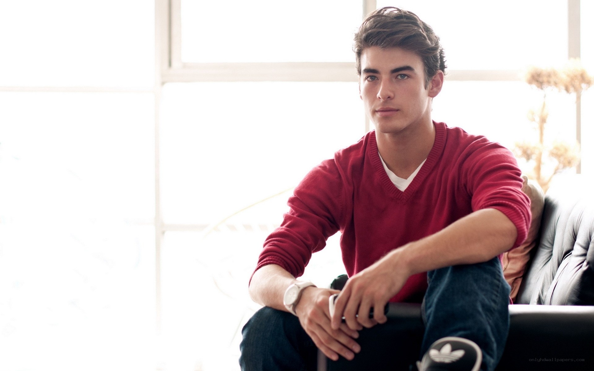 man in red sweater sitting