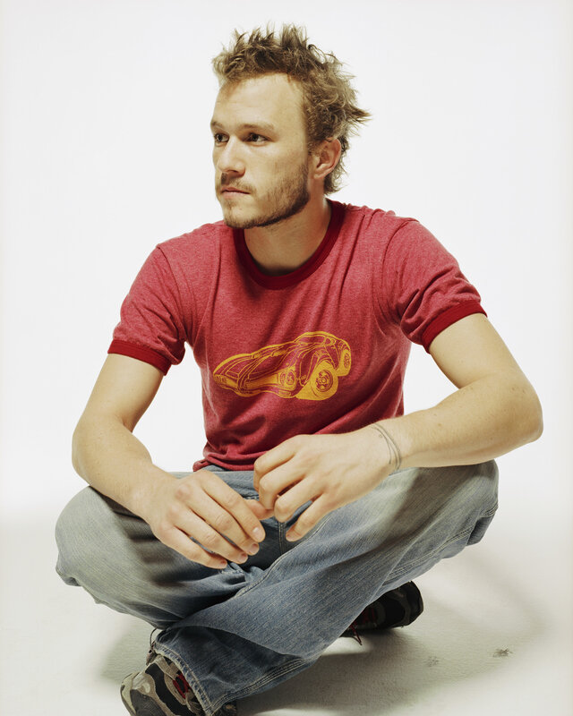 man in red t-shirt sitting