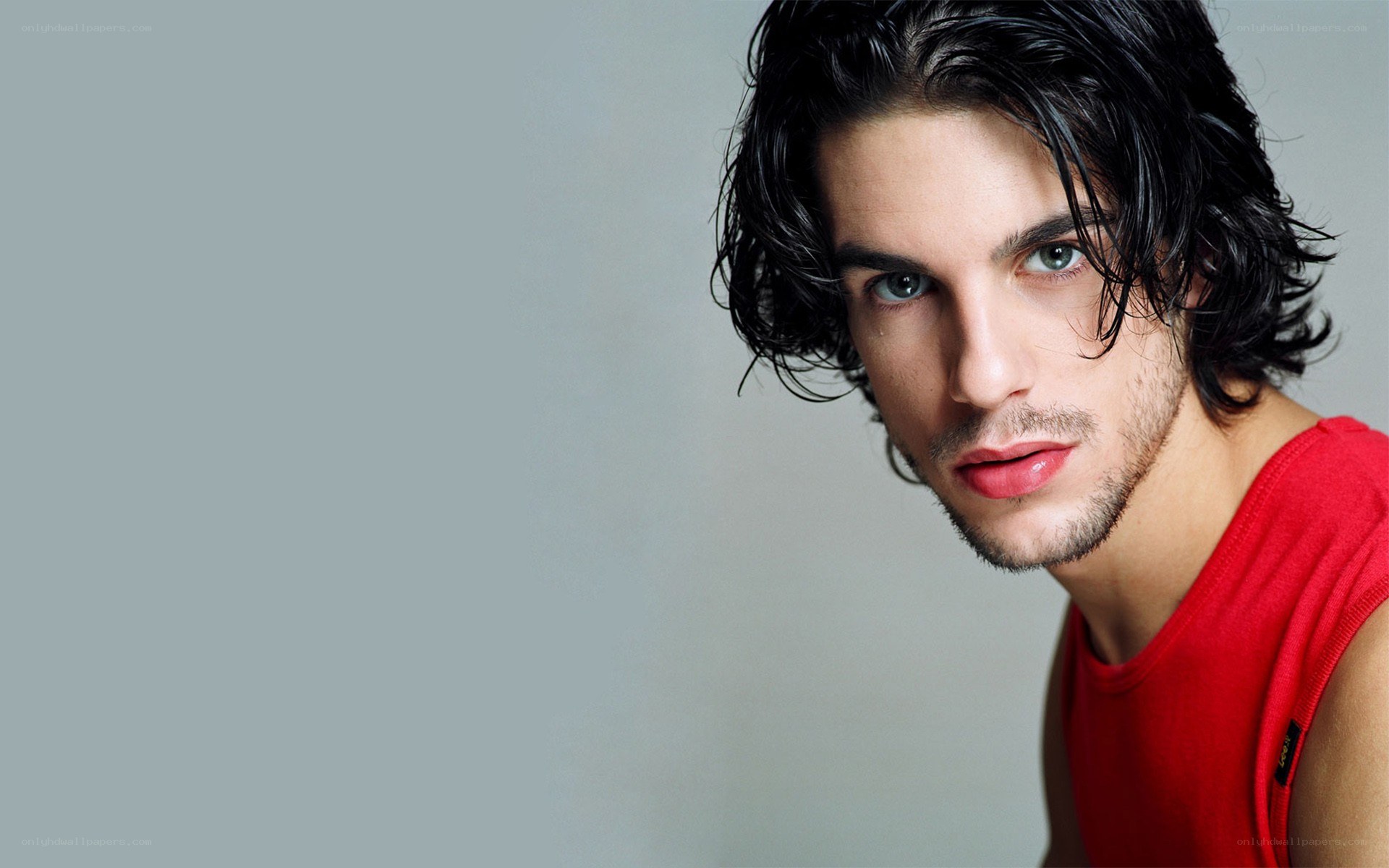 man in red tank top