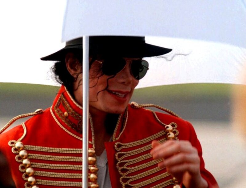 Man in Red Uniform — Dramatic, Photograph, Umbrella