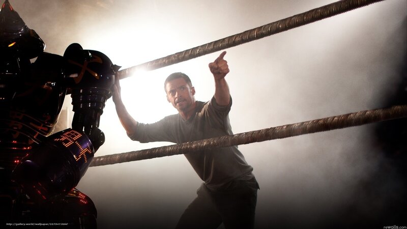 Man in ring with robot