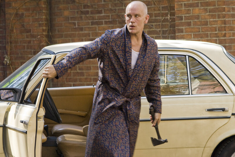 Man in robe holding axe