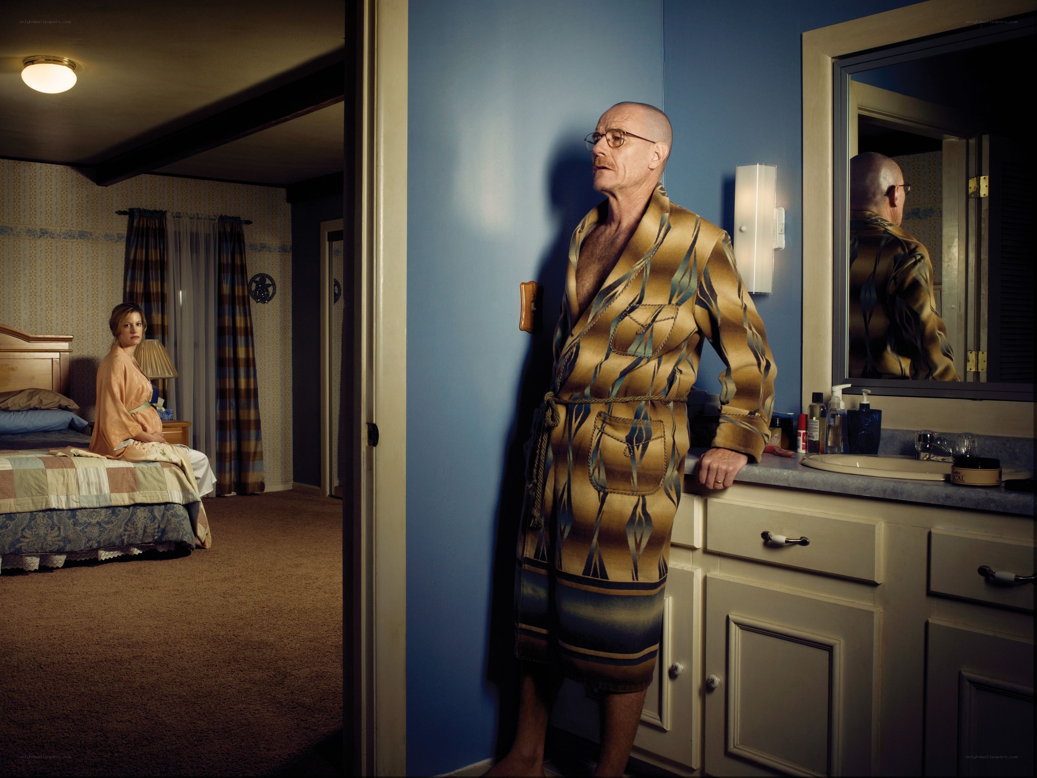 Man in robe in bathroom
