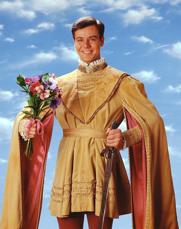 Man in royal costume with flowers
