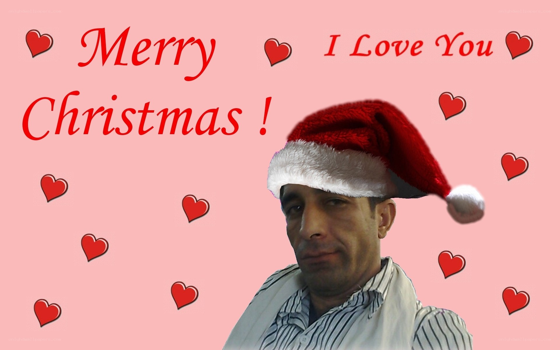 man in santa hat with hearts