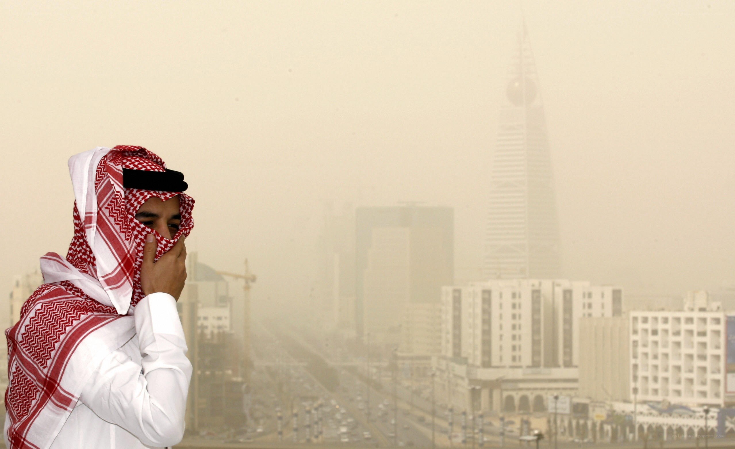 Man in scarf during sandstorm
