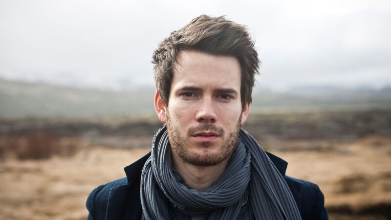 man in scarf outdoors