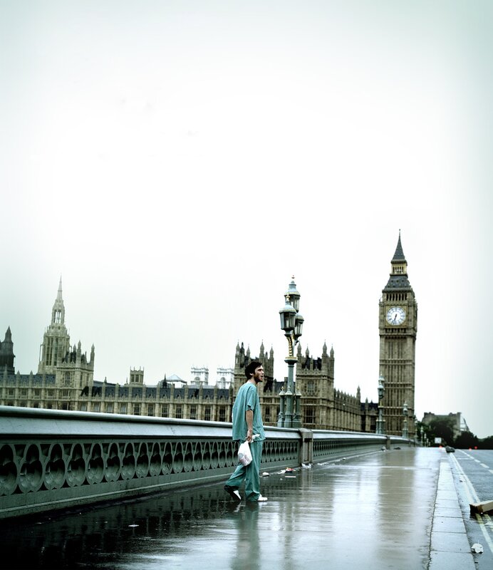 Man in scrubs on London bridge