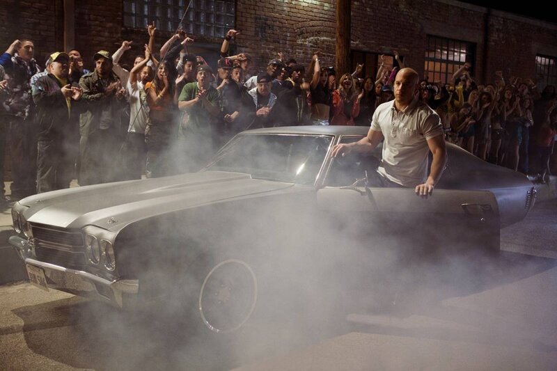 Man in Silver Car