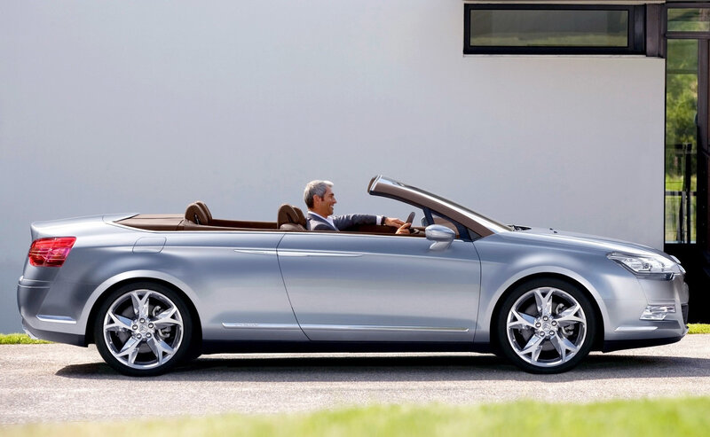 Man in silver convertible
