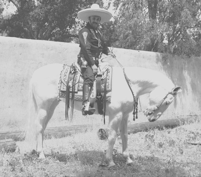 man in sombrero on horse