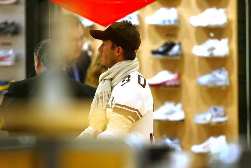 Man in sports jersey at shoe store