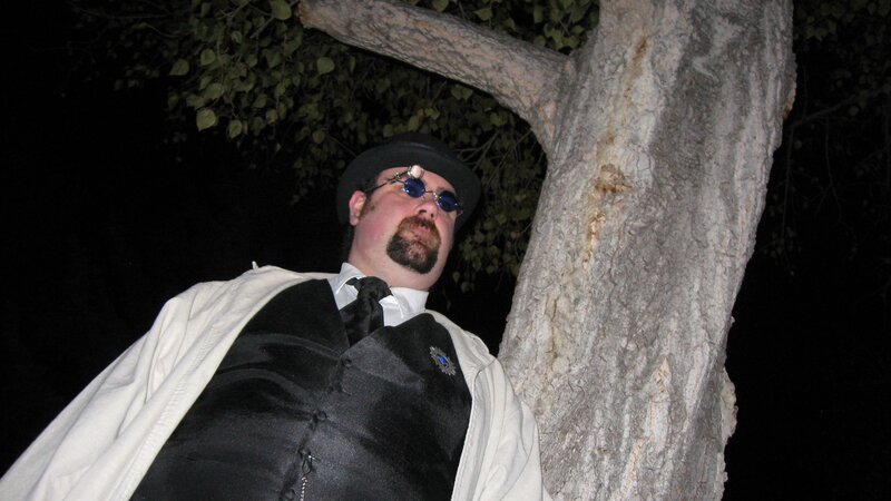 man in steampunk costume at night