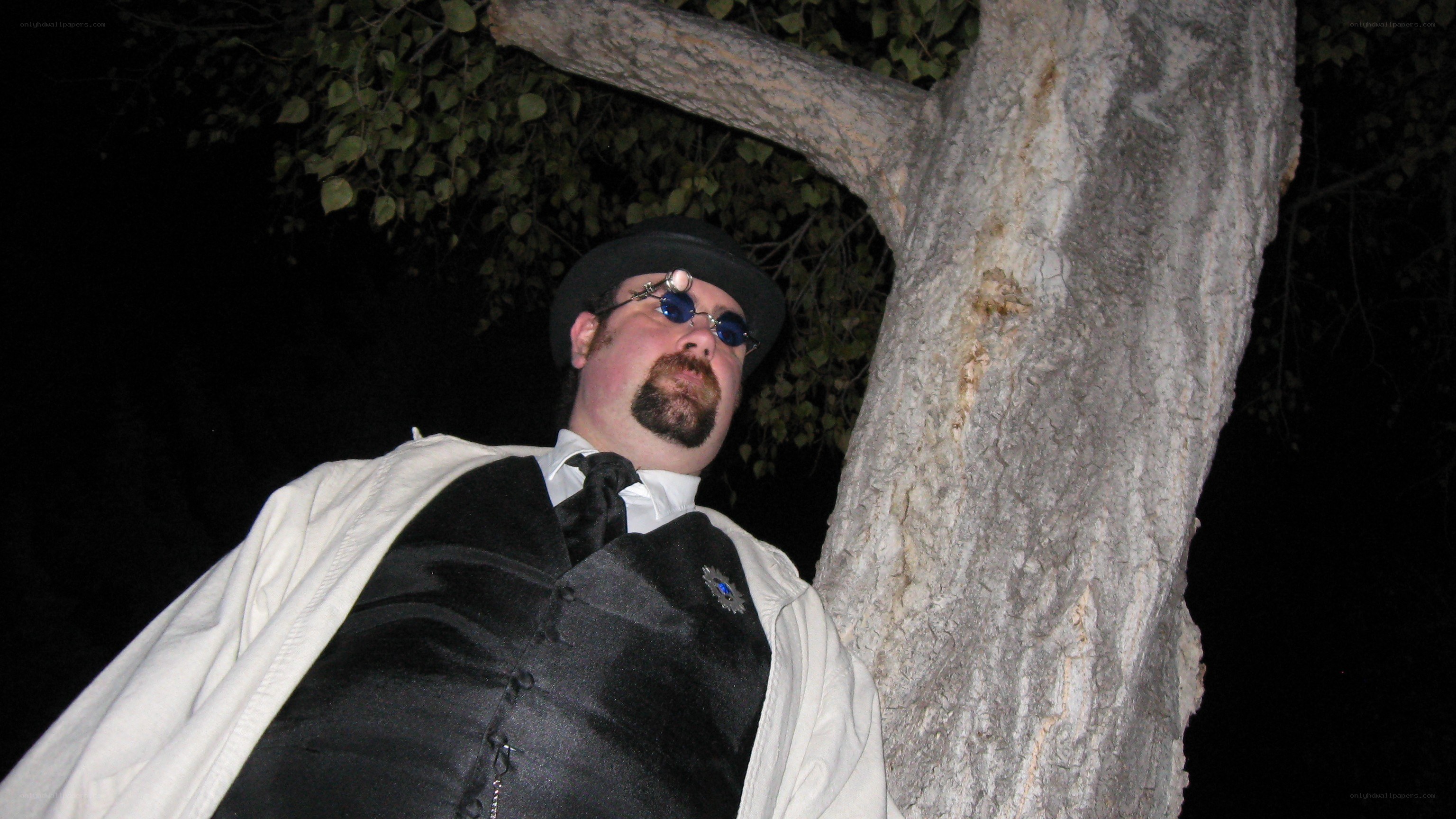man in steampunk costume at night