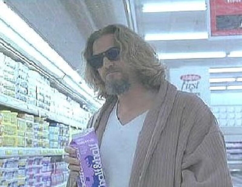 man in store holding snack