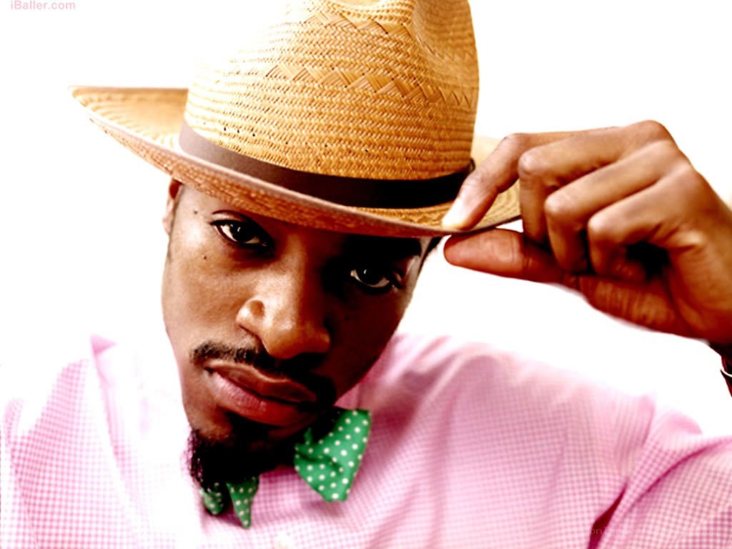 man in straw hat and bow tie
