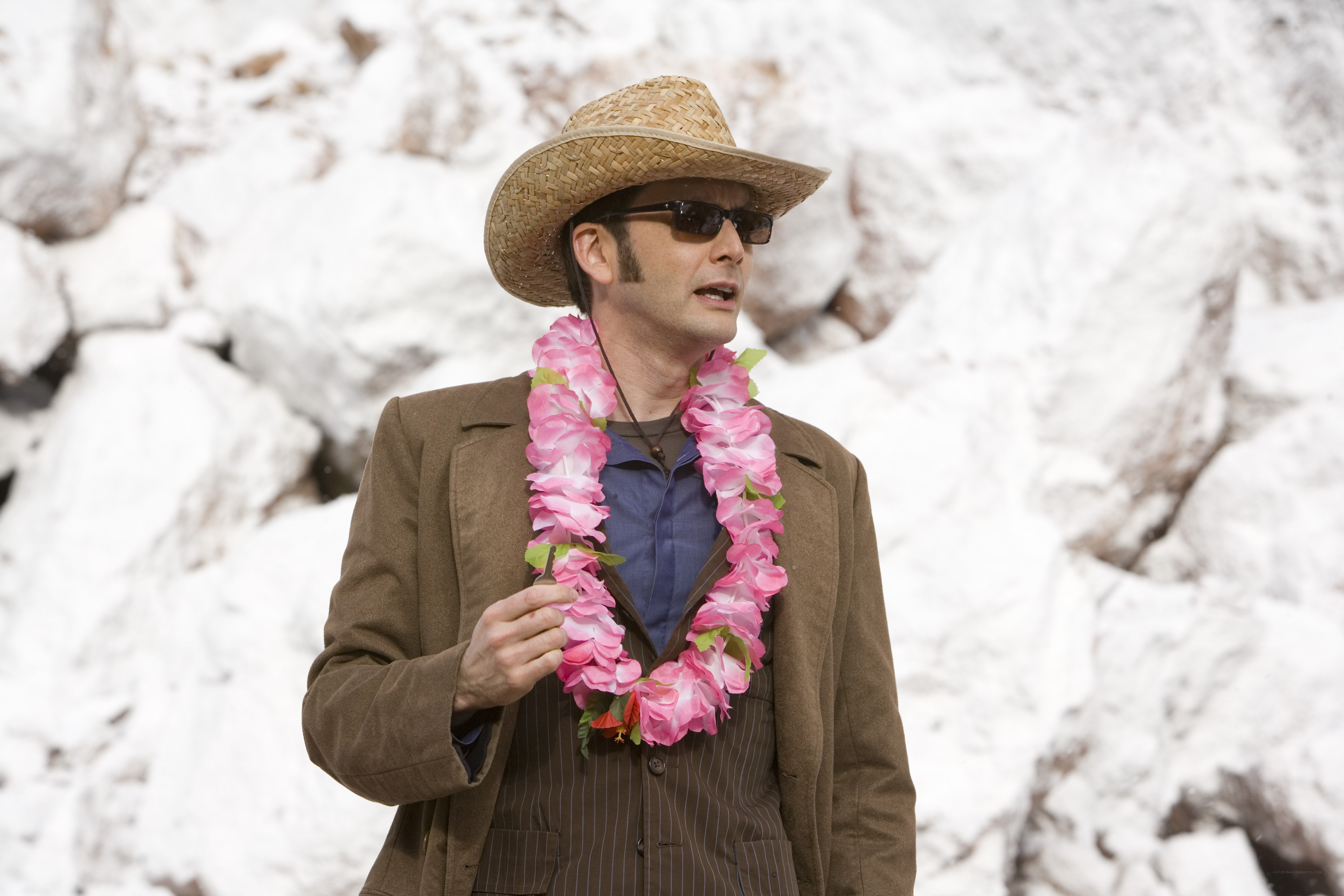man in straw hat with lei