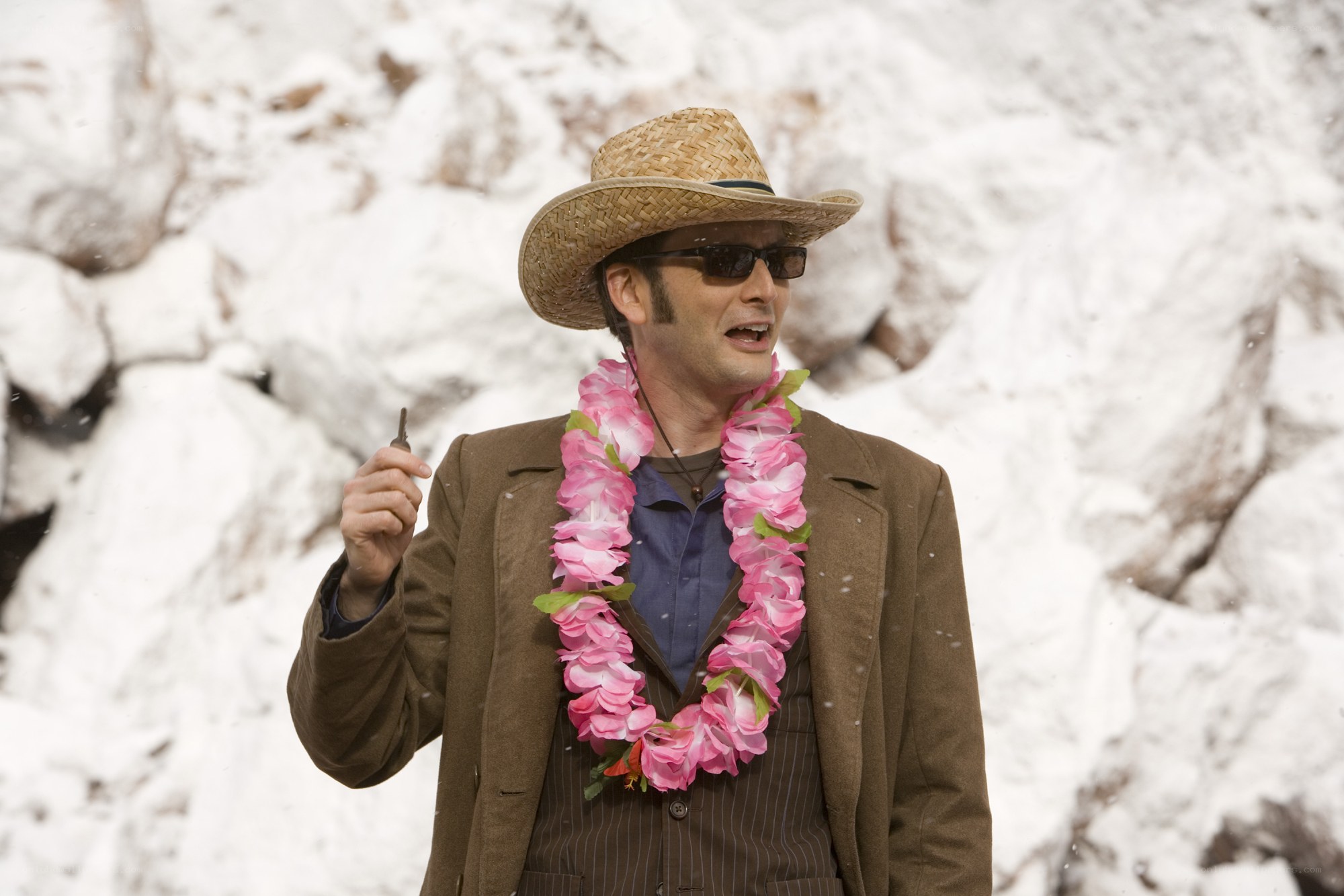 man in straw hat with lei