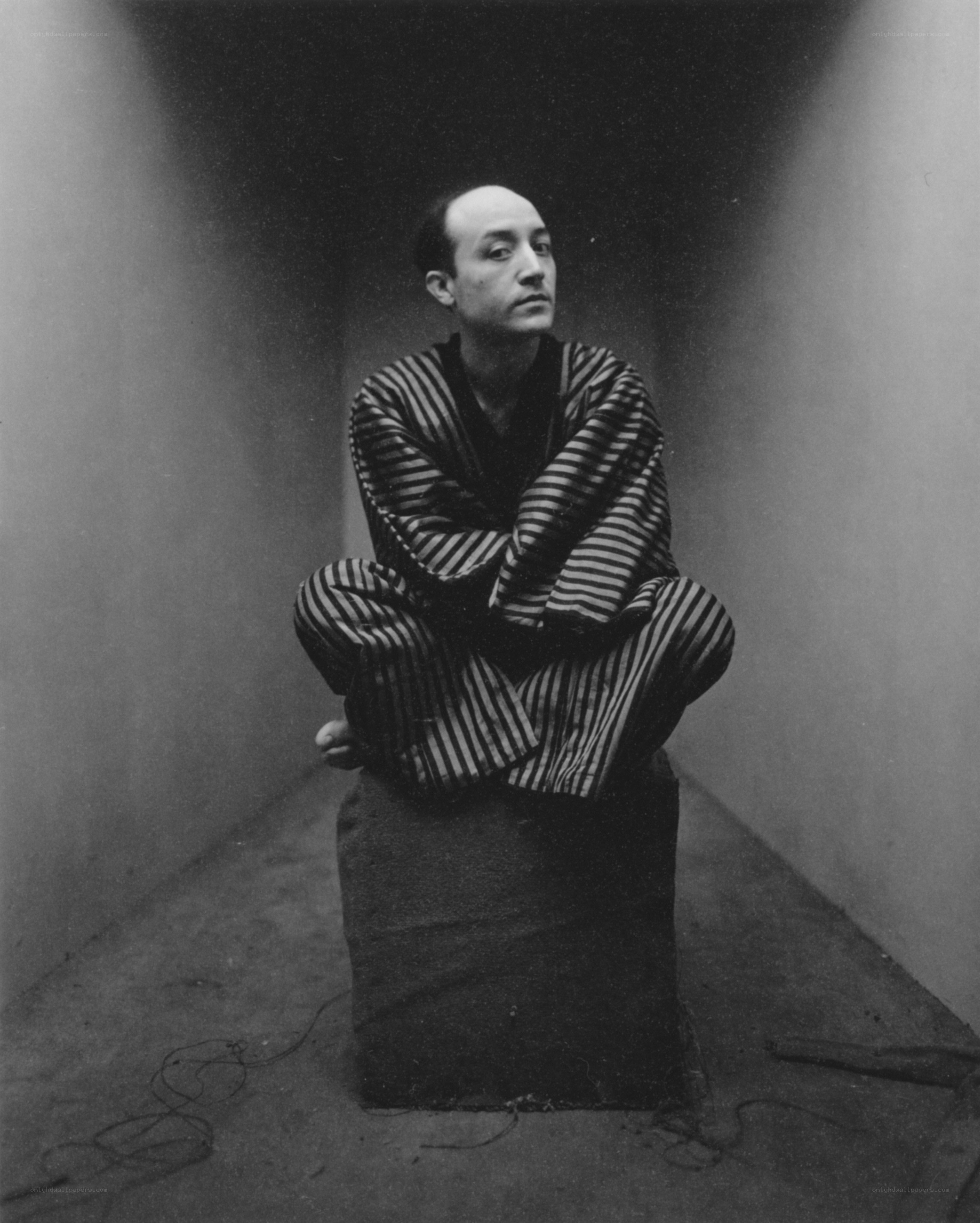 Man in striped robe sitting