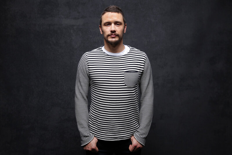 man in striped shirt