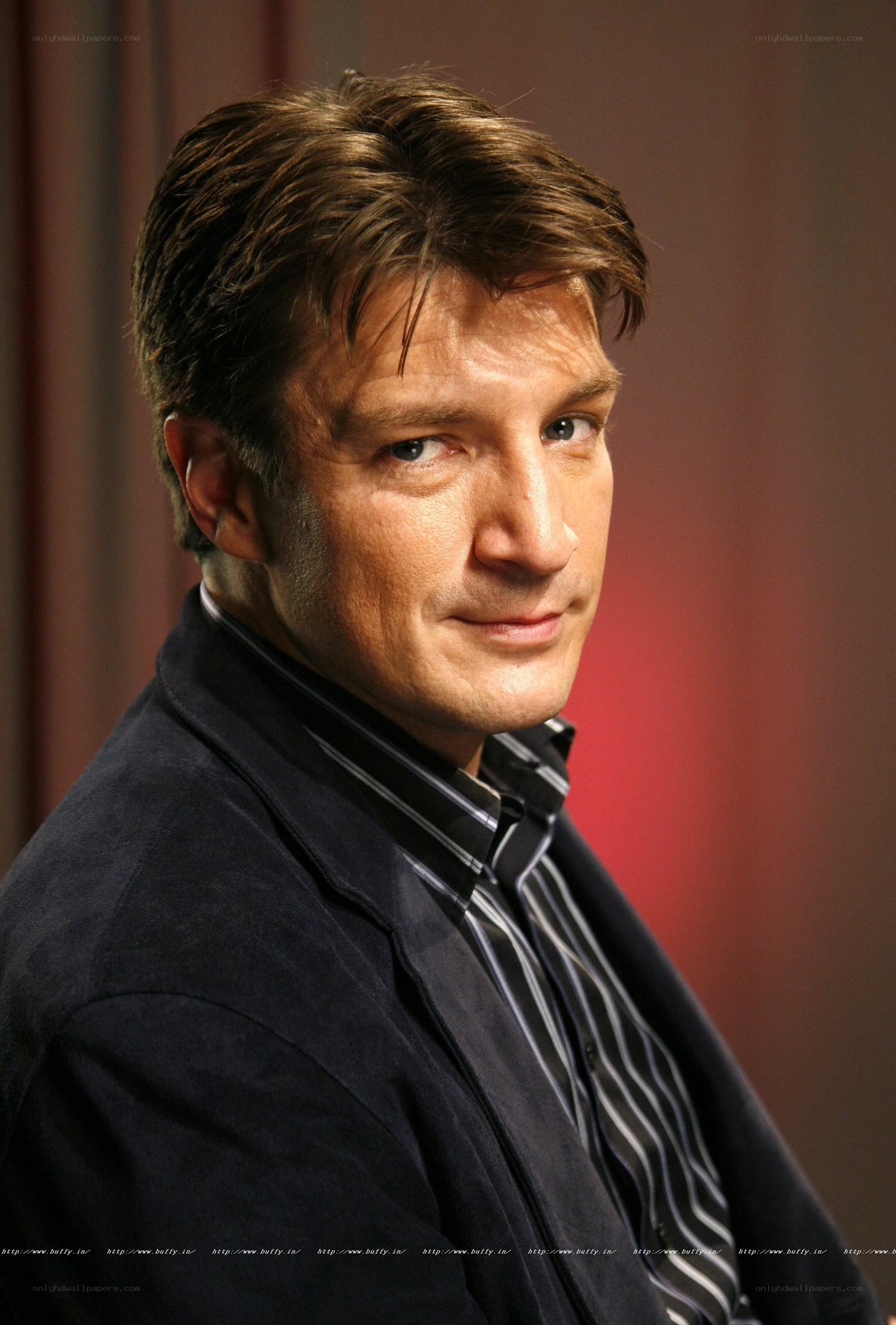man in striped shirt and jacket