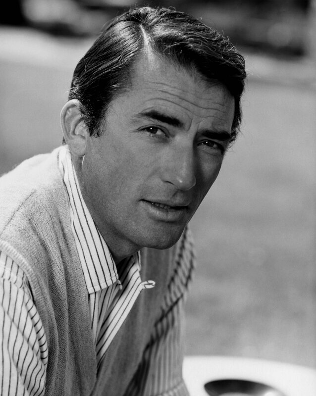 man in striped shirt and sweater