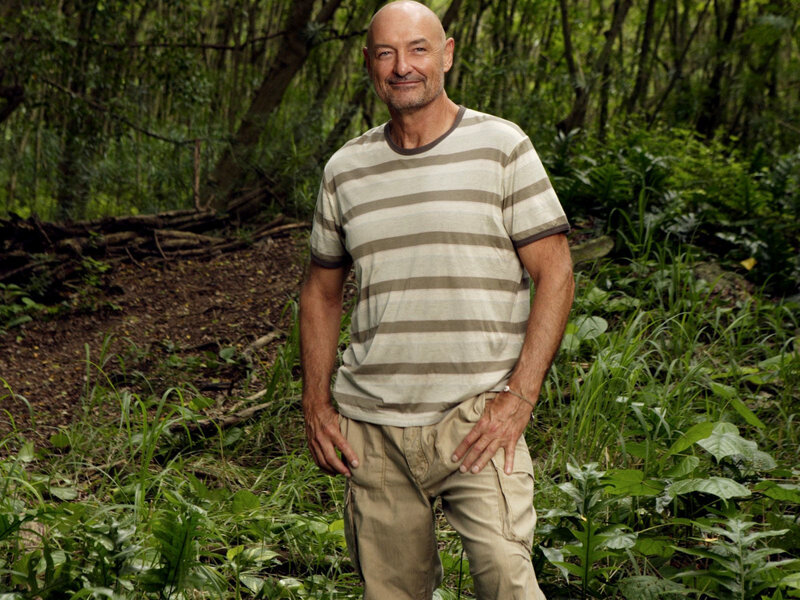 man in striped shirt in forest