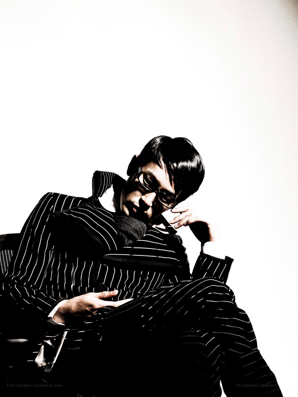 man in striped suit sitting