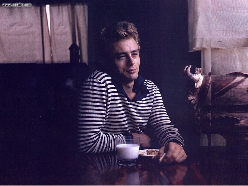 man in striped sweater at table