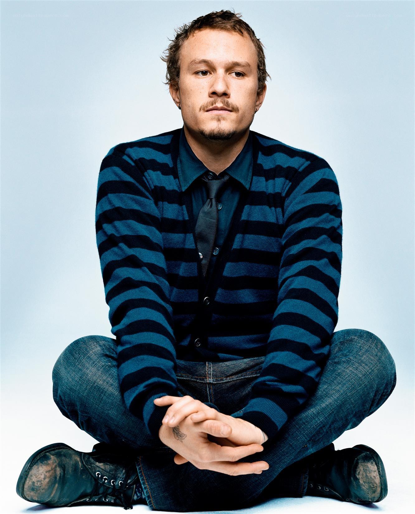 man in striped sweater sitting