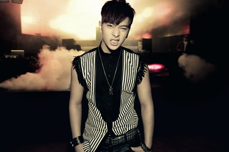 man in striped vest posing