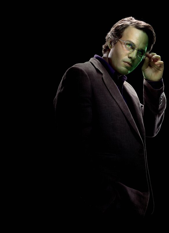 man in suit adjusting glasses