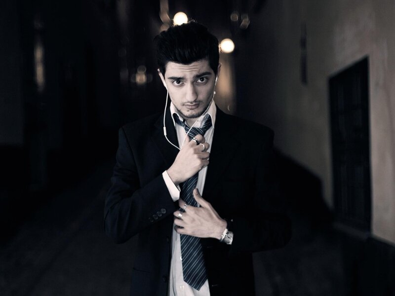 Man in Suit Adjusting Tie — Black, Dramatic, Night, Photograph