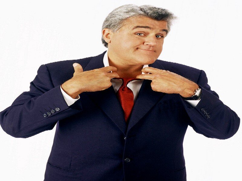 Man in Suit Adjusting Tie — Blue