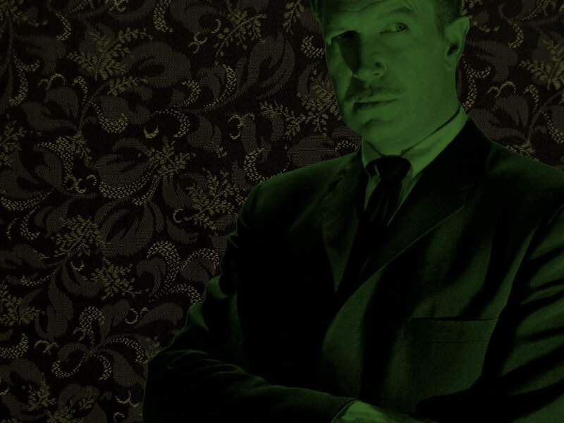 man in suit against patterned wall