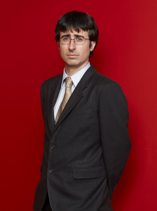 man in suit against red background
