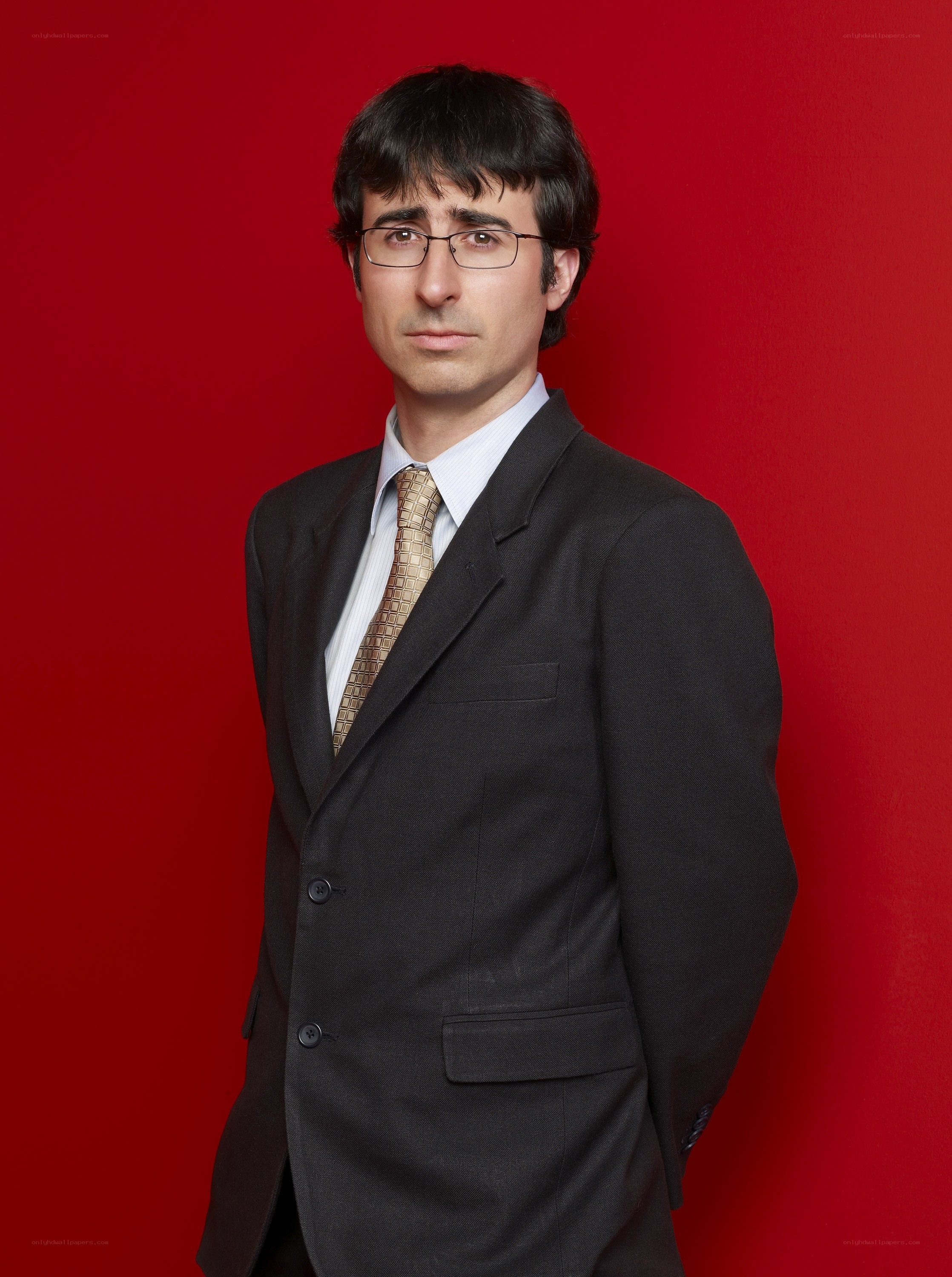 man in suit against red background