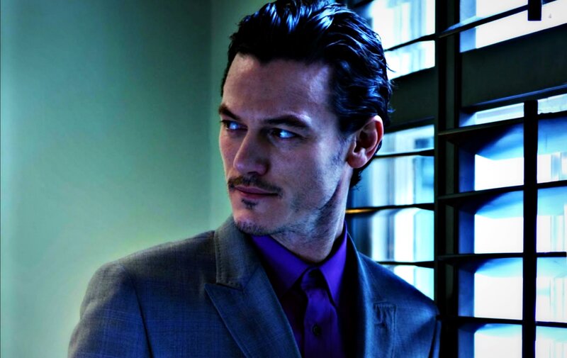 Man in Suit and Purple Shirt