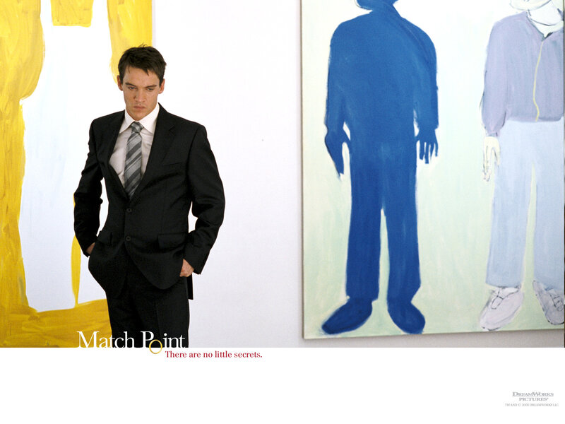 Man in suit at art gallery