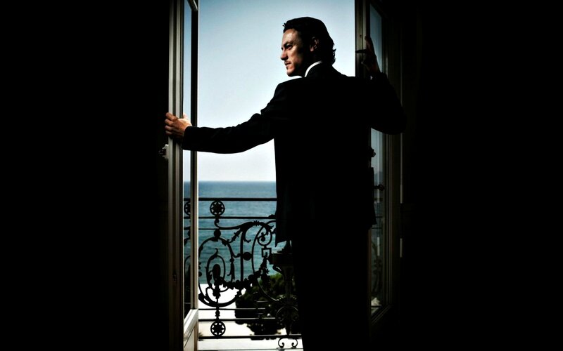 Man in Suit at Balcony