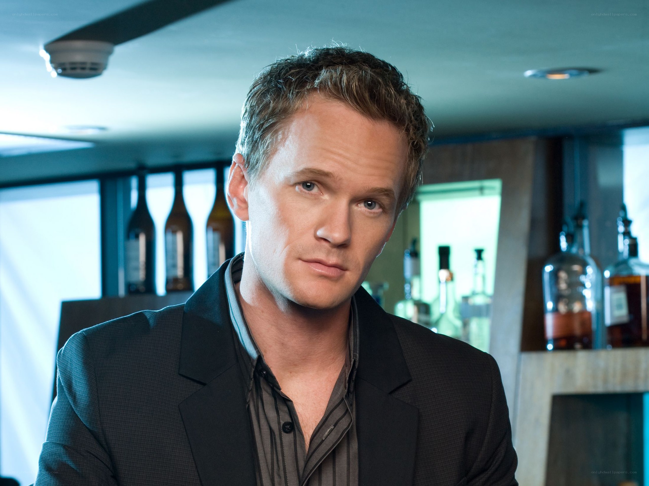 man in suit at bar