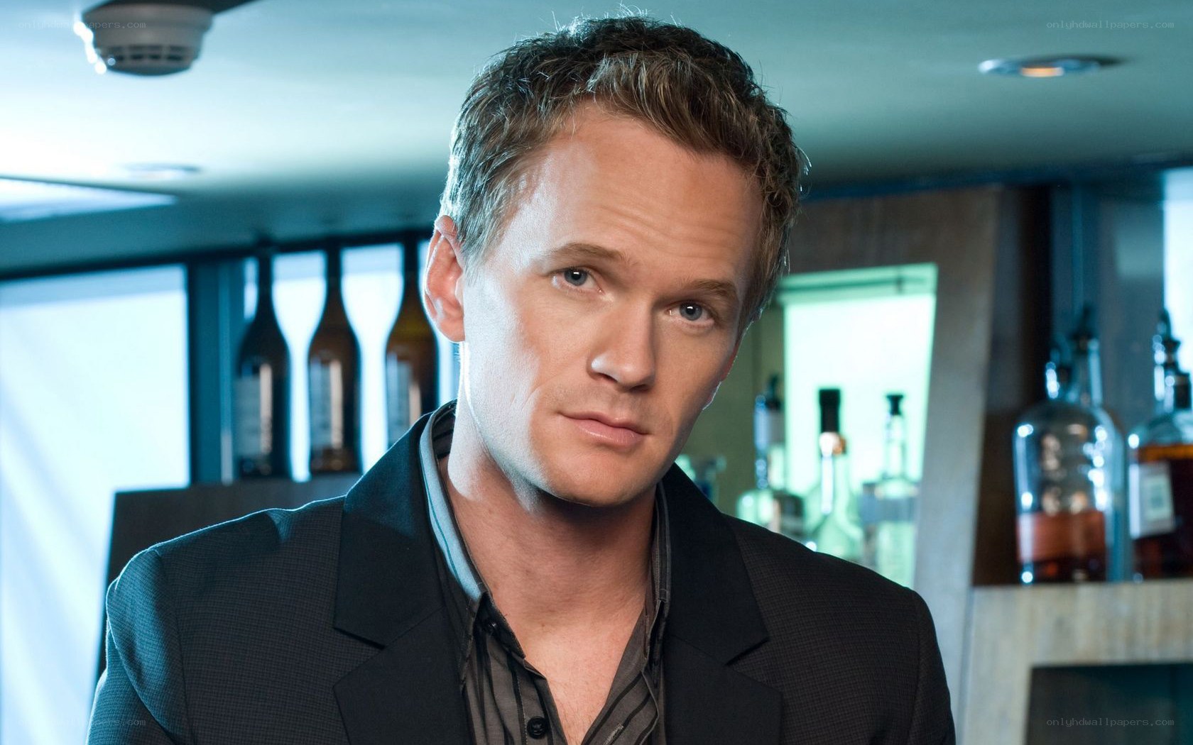 man in suit at bar