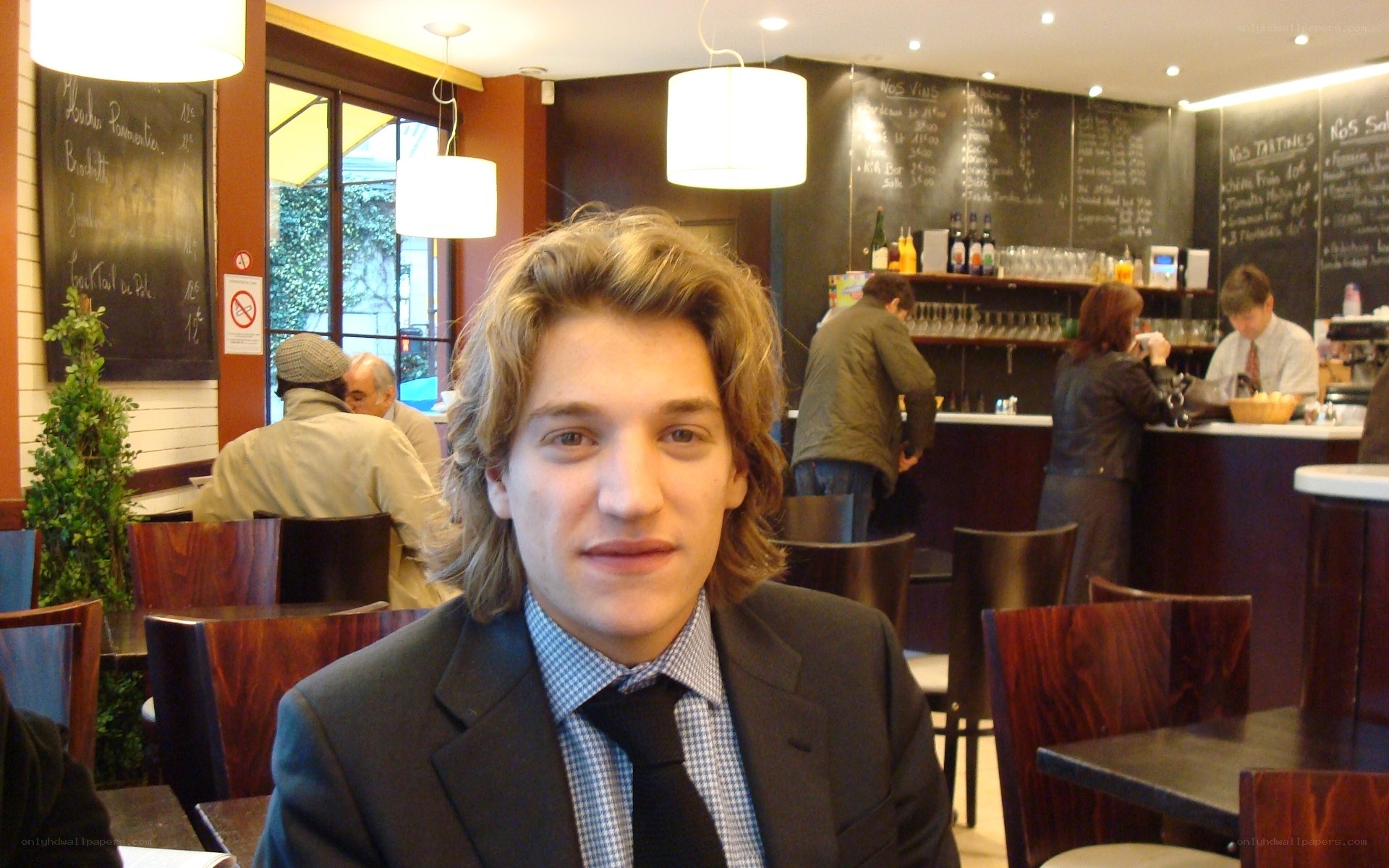 man in suit at cafe