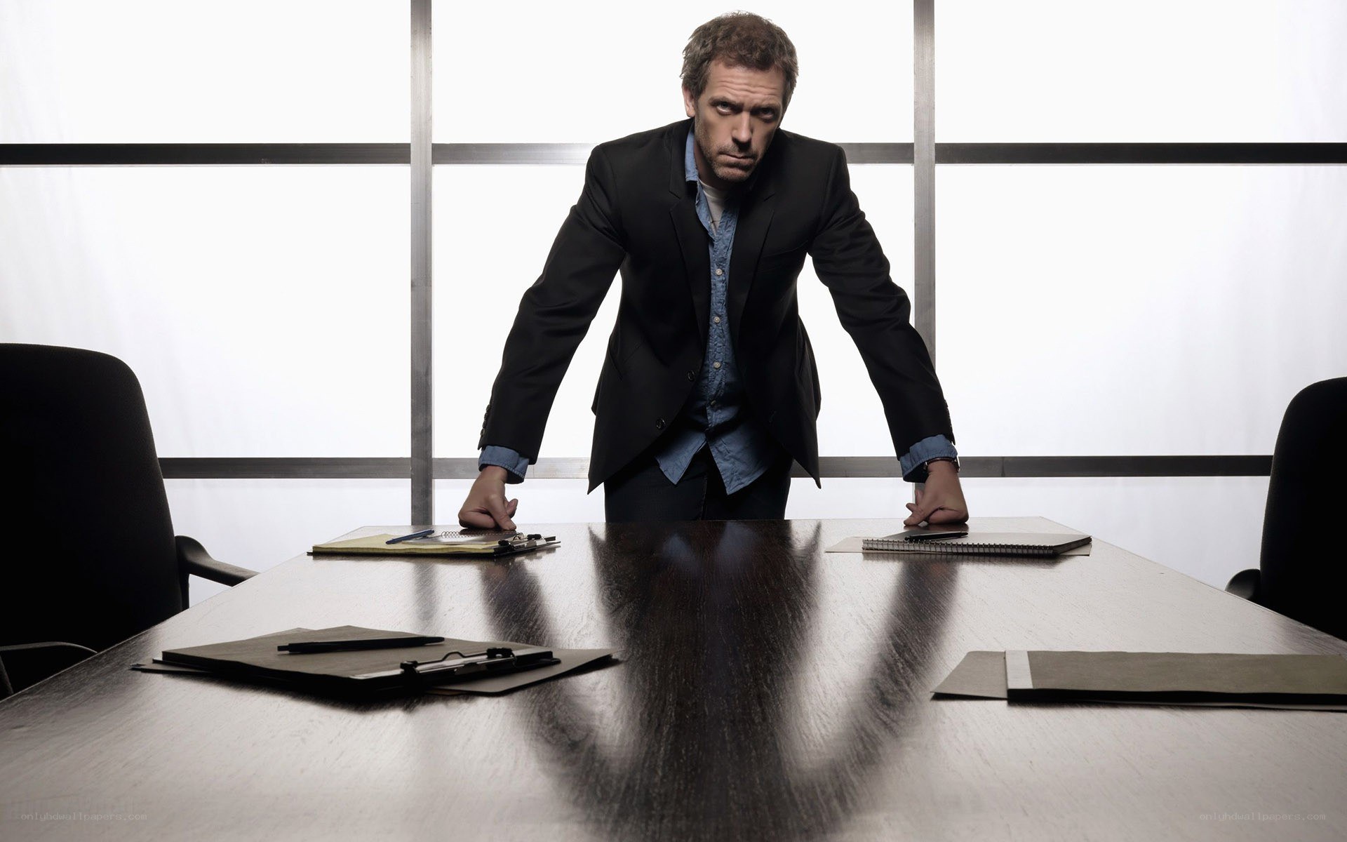 man in suit at conference table