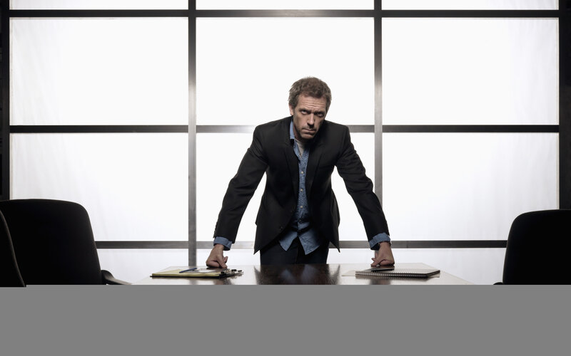 man in suit at conference table